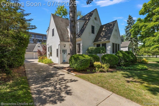 524 Oakland Ave, Birmingham, MI 48009 - view of front of home featuring a front yard and a garage