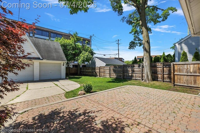 524 Oakland Ave, Birmingham, MI 48009 - fenced backyard featuring a garage and a patio area