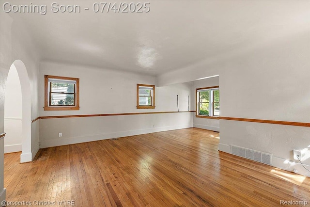 524 Oakland Ave, Birmingham, MI 48009 - unfurnished room featuring hardwood / wood-style floors and arched walkways