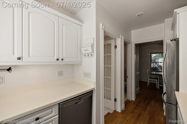 524 Oakland Ave, Birmingham, MI 48009 - kitchen featuring stainless steel appliances, white cabinetry, dark wood-style floors, and light countertops