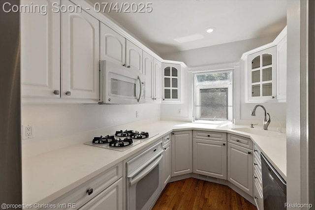 524 Oakland Ave, Birmingham, MI 48009 - kitchen featuring white appliances, glass insert cabinets, dark wood-style floors, and white cabinetry