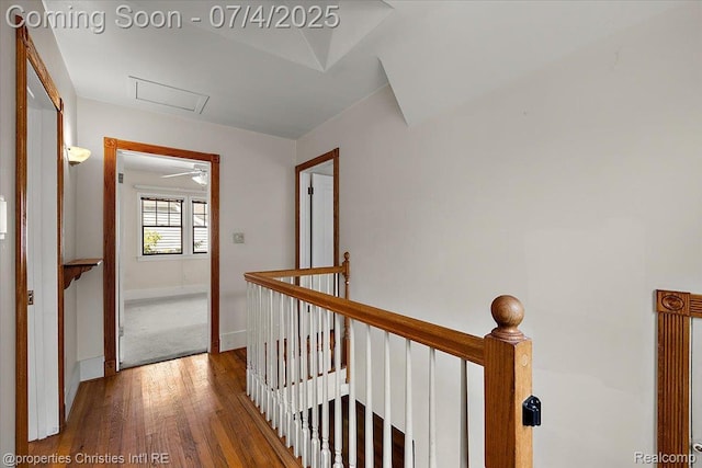 524 Oakland Ave, Birmingham, MI 48009 - hallway with an upstairs landing, attic access, and wood finished floors