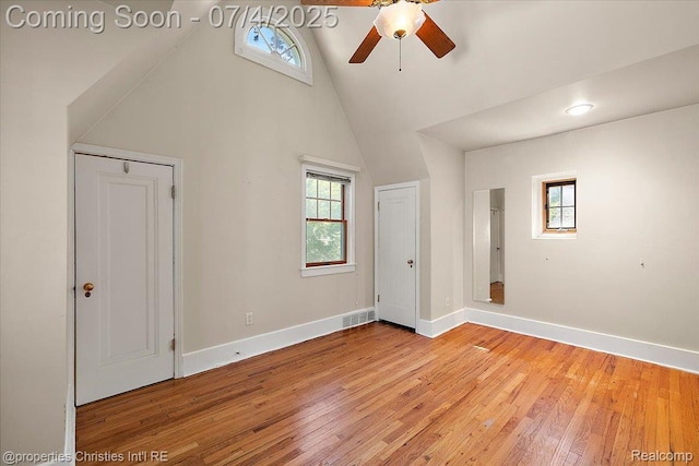 524 Oakland Ave, Birmingham, MI 48009 - unfurnished bedroom with multiple windows, light wood-style floors, high vaulted ceiling, and a ceiling fan