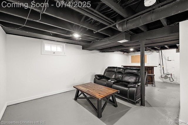 524 Oakland Ave, Birmingham, MI 48009 - living room featuring concrete floors and a dry bar