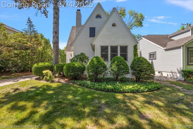 524 Oakland Ave, Birmingham, MI 48009 - view of property exterior featuring a yard and a chimney
