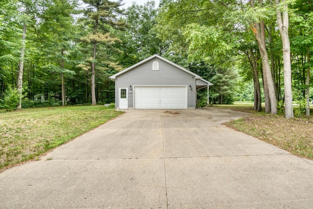 19085 Joslin Cir, Big Rapids, MI 49307 - view of front of property featuring a front lawn and a detached garage