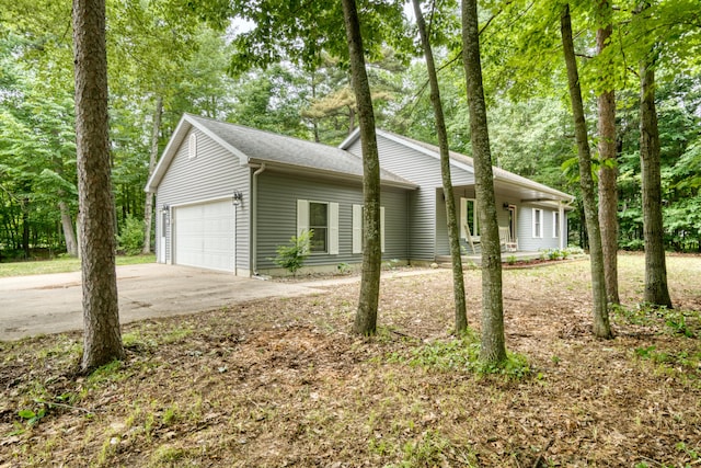 19085 Joslin Cir, Big Rapids, MI 49307 - view of front facade featuring an attached garage and concrete driveway