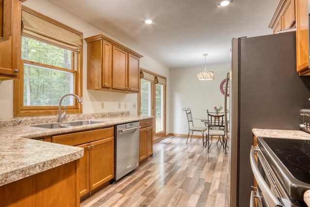 19085 Joslin Cir, Big Rapids, MI 49307 - kitchen featuring stainless steel appliances, light wood-type flooring, plenty of natural light, light countertops, and recessed lighting