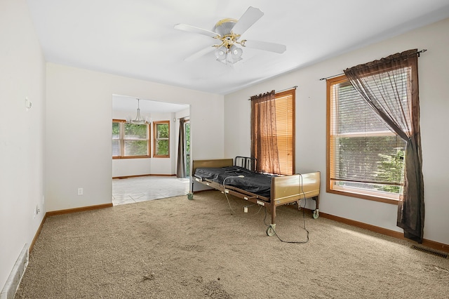 7906 N 43rd St, Augusta, MI 49012 - playroom featuring plenty of natural light, a chandelier, carpet flooring, and a ceiling fan