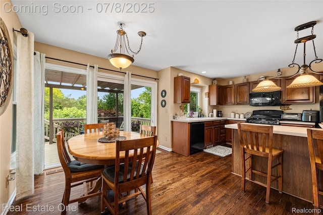 17734 Huron Dr, Macomb, MI 48042 - dining space featuring dark wood finished floors and baseboards