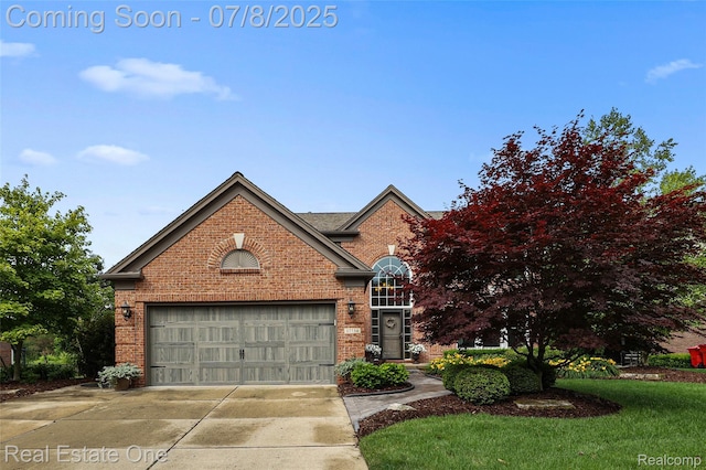 17734 Huron Dr, Macomb, MI 48042 - traditional-style house with brick siding, concrete driveway, and a garage