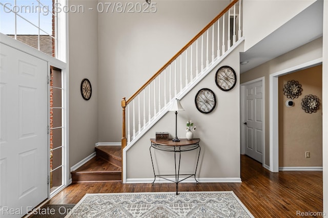 17734 Huron Dr, Macomb, MI 48042 - entryway featuring wood finished floors, stairs, and a towering ceiling