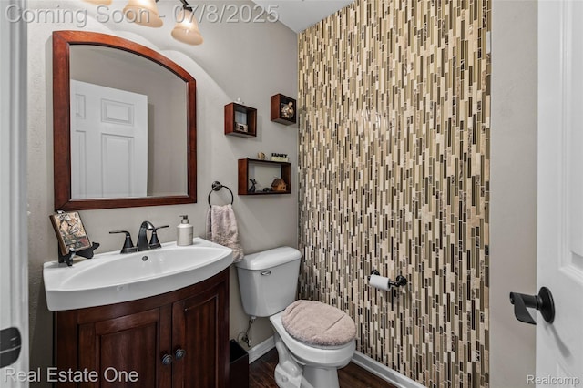 17734 Huron Dr, Macomb, MI 48042 - half bathroom with vanity and wood finished floors
