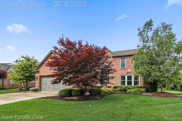 17734 Huron Dr, Macomb, MI 48042 - view of front of home with brick siding, concrete driveway, a front yard, and an attached garage
