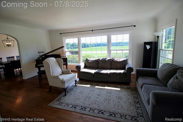 4201 N Burkhart Rd, Howell, MI 48855 - living area with wood finished floors, healthy amount of natural light, and a chandelier