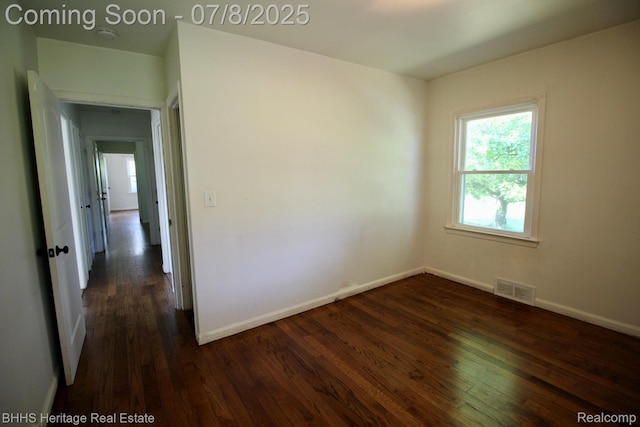4201 N Burkhart Rd, Howell, MI 48855 - spare room featuring dark wood finished floors and a smoke detector
