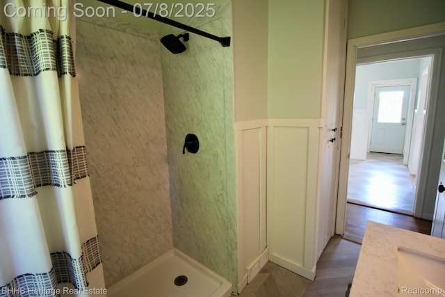4201 N Burkhart Rd, Howell, MI 48855 - full bath with walk in shower, wood finished floors, and wainscoting