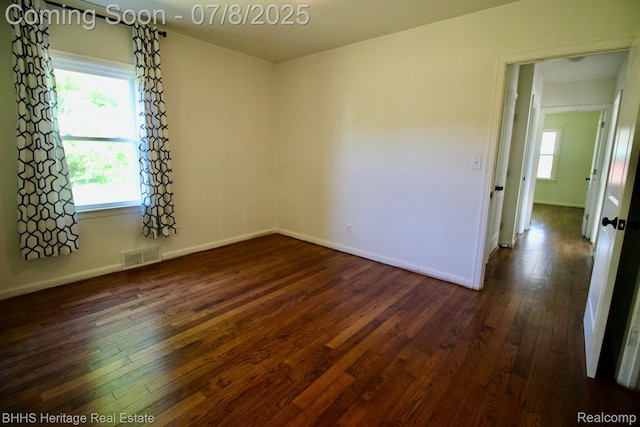 4201 N Burkhart Rd, Howell, MI 48855 - empty room featuring dark wood-style flooring