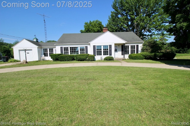 4201 N Burkhart Rd, Howell, MI 48855 - view of front facade featuring a front yard and a chimney