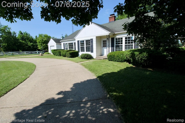 4201 N Burkhart Rd, Howell, MI 48855 - view of front of property featuring a chimney