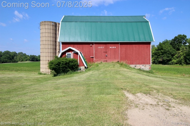 4201 N Burkhart Rd, Howell, MI 48855 - view of barn featuring a yard