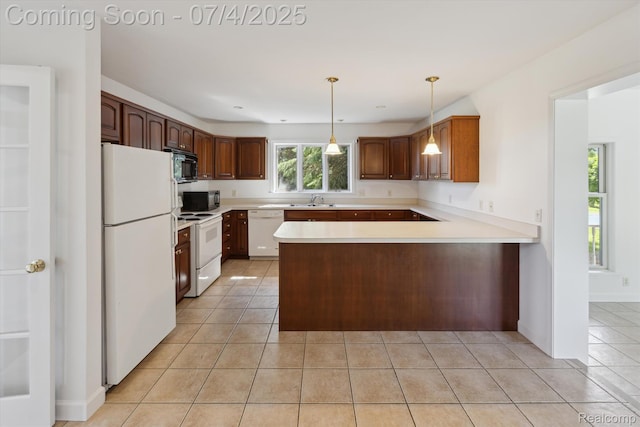 10934 Baker Rd, Frankenmuth, MI 48734 - kitchen featuring white appliances, light tile patterned flooring, a peninsula, light countertops, and pendant lighting