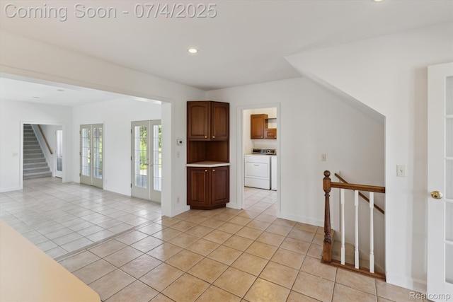 10934 Baker Rd, Frankenmuth, MI 48734 - spare room with washer / clothes dryer, light tile patterned floors, recessed lighting, and stairway