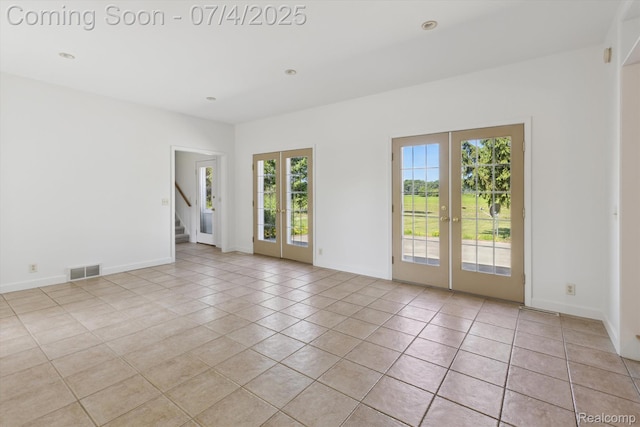 10934 Baker Rd, Frankenmuth, MI 48734 - unfurnished room with french doors, light tile patterned floors, stairway, and recessed lighting