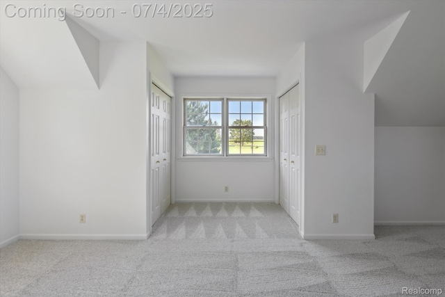 10934 Baker Rd, Frankenmuth, MI 48734 - unfurnished bedroom featuring two closets and carpet