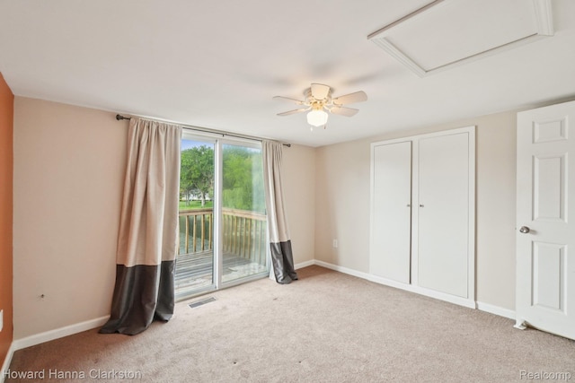 6830 Dixie Hwy, Clarkston, MI 48346 - unfurnished bedroom with access to outside, attic access, carpet, and ceiling fan