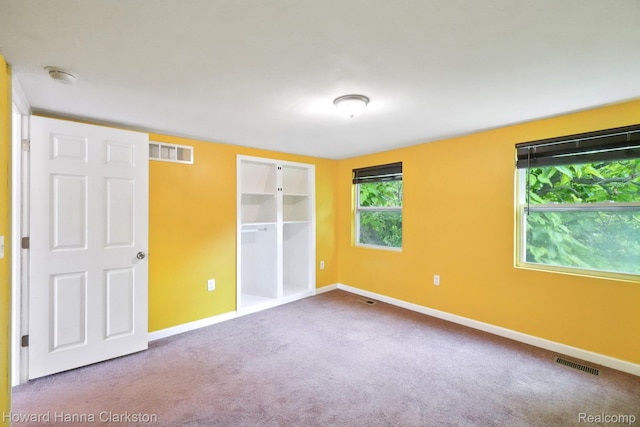 6830 Dixie Hwy, Clarkston, MI 48346 - unfurnished bedroom featuring carpet flooring and a closet