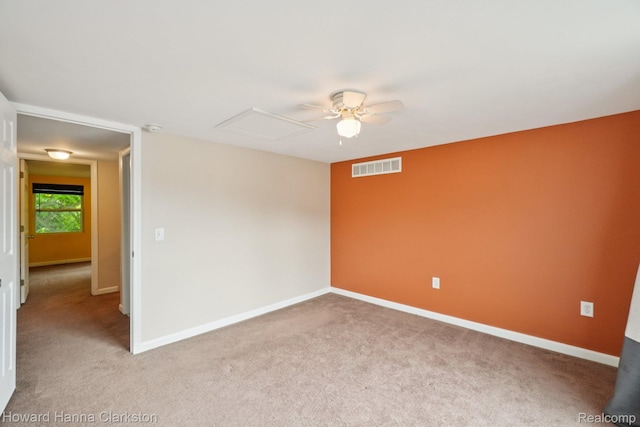 6830 Dixie Hwy, Clarkston, MI 48346 - empty room featuring carpet floors, attic access, a ceiling fan, and a smoke detector