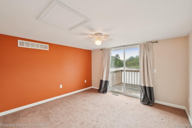6830 Dixie Hwy, Clarkston, MI 48346 - carpeted empty room with attic access and ceiling fan
