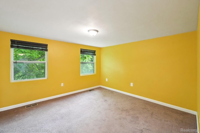 6830 Dixie Hwy, Clarkston, MI 48346 - spare room featuring carpet flooring and baseboards