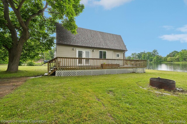 6830 Dixie Hwy, Clarkston, MI 48346 - back of house featuring a deck with water view, a lawn, a shingled roof, and french doors
