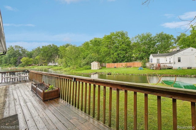 6830 Dixie Hwy, Clarkston, MI 48346 - wooden terrace featuring a shed, a water view, a yard, and view of scattered trees