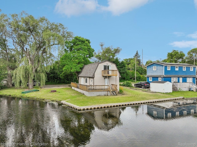 6830 Dixie Hwy, Clarkston, MI 48346 - back of house featuring a gambrel roof, a yard, and a deck with water view