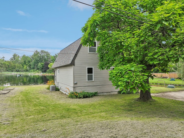 6830 Dixie Hwy, Clarkston, MI 48346 - view of property exterior featuring a shingled roof and a water view