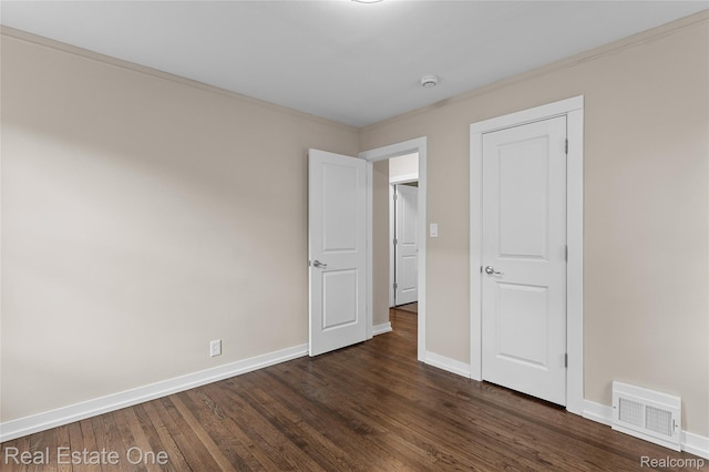 1746 N Lafayette St, Dearborn, MI 48128 - unfurnished bedroom featuring dark wood-style floors and baseboards