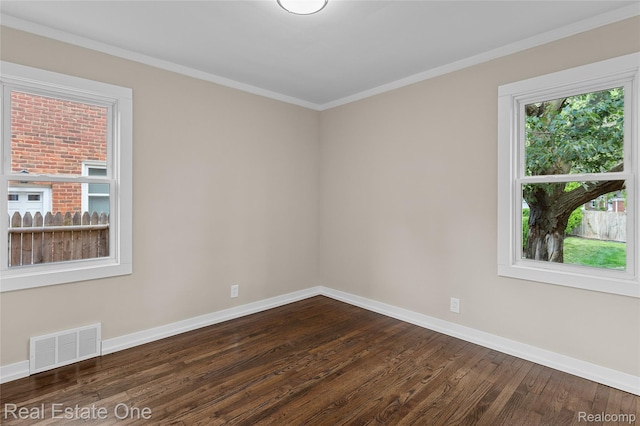 1746 N Lafayette St, Dearborn, MI 48128 - spare room featuring dark wood-style floors and crown molding