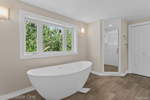 1746 N Lafayette St, Dearborn, MI 48128 - bathroom featuring a freestanding tub, a stall shower, and recessed lighting