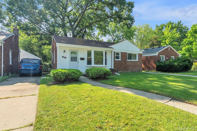 1885 Pelham St, Dearborn, MI 48124 - view of front of home with brick siding and a front lawn
