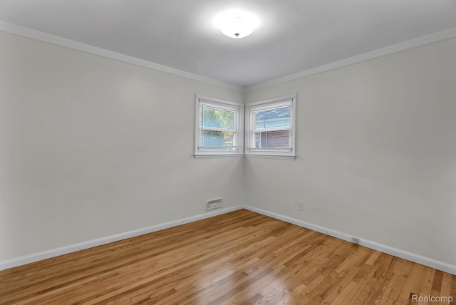 1885 Pelham St, Dearborn, MI 48124 - spare room featuring light wood-style floors and ornamental molding