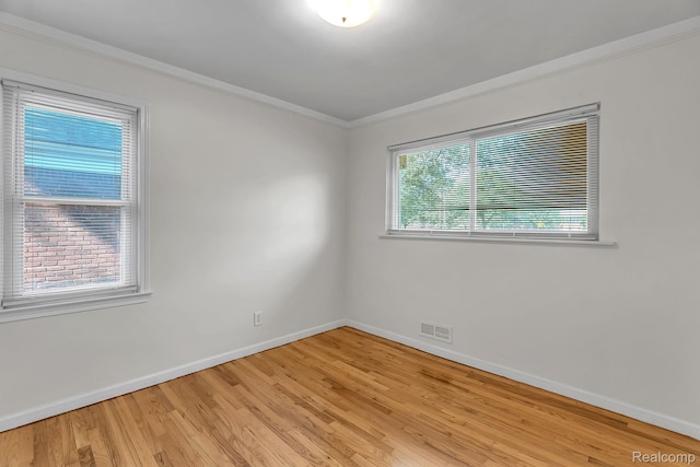 1885 Pelham St, Dearborn, MI 48124 - unfurnished room featuring crown molding and light wood-style floors