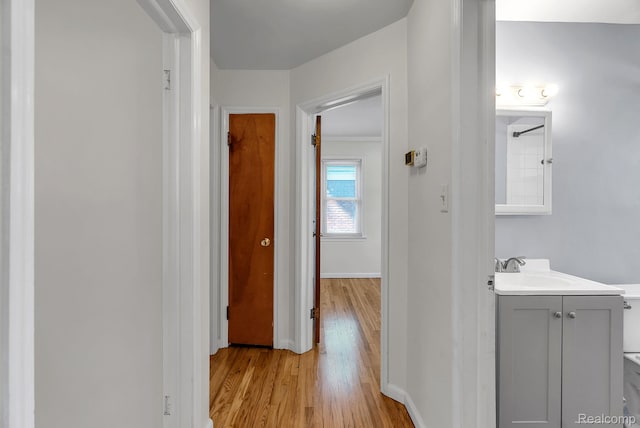 1885 Pelham St, Dearborn, MI 48124 - hall with light wood-style flooring and baseboards