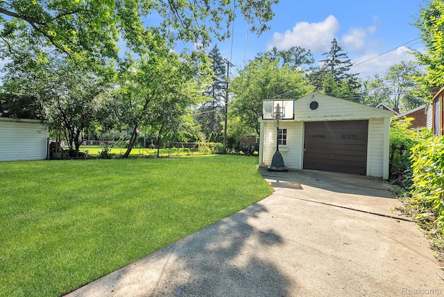 1885 Pelham St, Dearborn, MI 48124 - view of yard with an outdoor structure, concrete driveway, and a garage