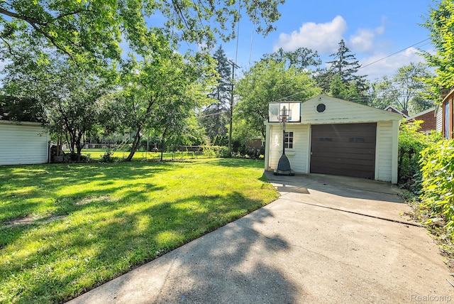 1885 Pelham St, Dearborn, MI 48124 - view of yard with an outdoor structure, concrete driveway, and a garage