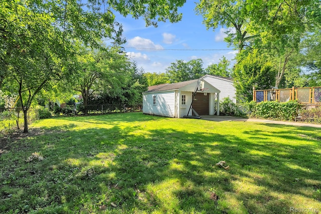 1885 Pelham St, Dearborn, MI 48124 - fenced backyard featuring an outdoor structure and a garage