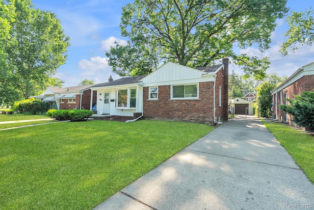 1885 Pelham St, Dearborn, MI 48124 - view of front of home featuring a chimney, brick siding, a front lawn, and concrete driveway