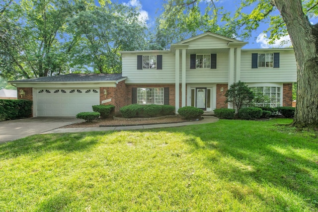 29947 Fernhill Dr, Farmington, MI 48331 - view of front of home featuring brick siding, a garage, driveway, and a front lawn